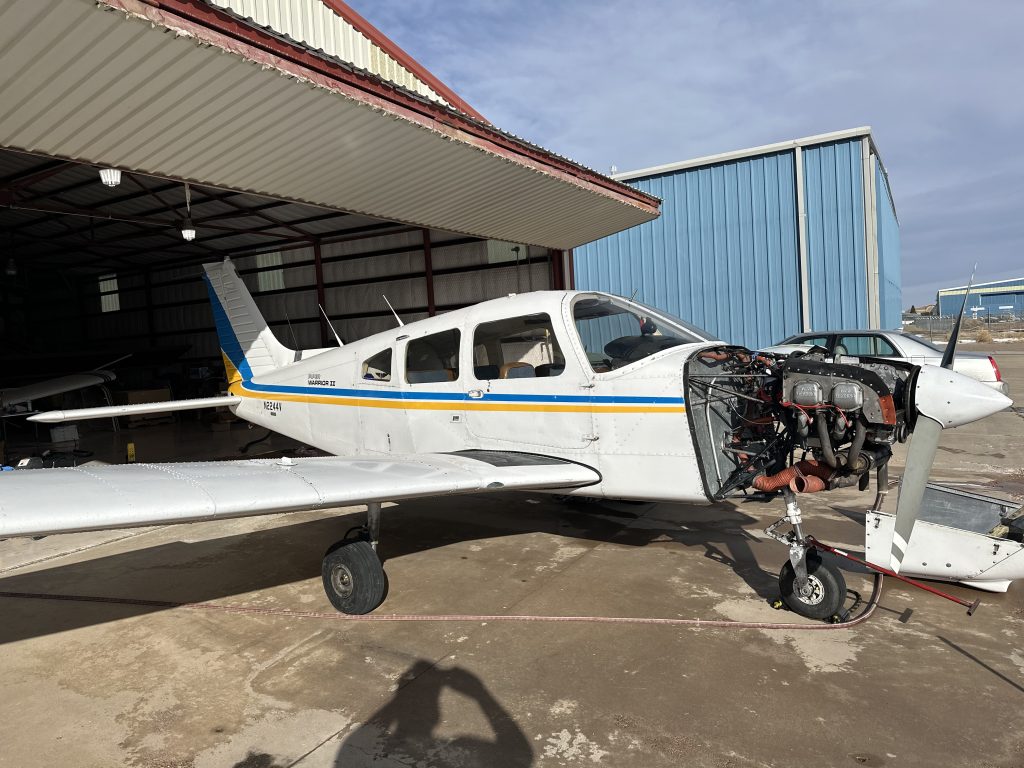 Piston aircraft in the Saber hangar during an inspection